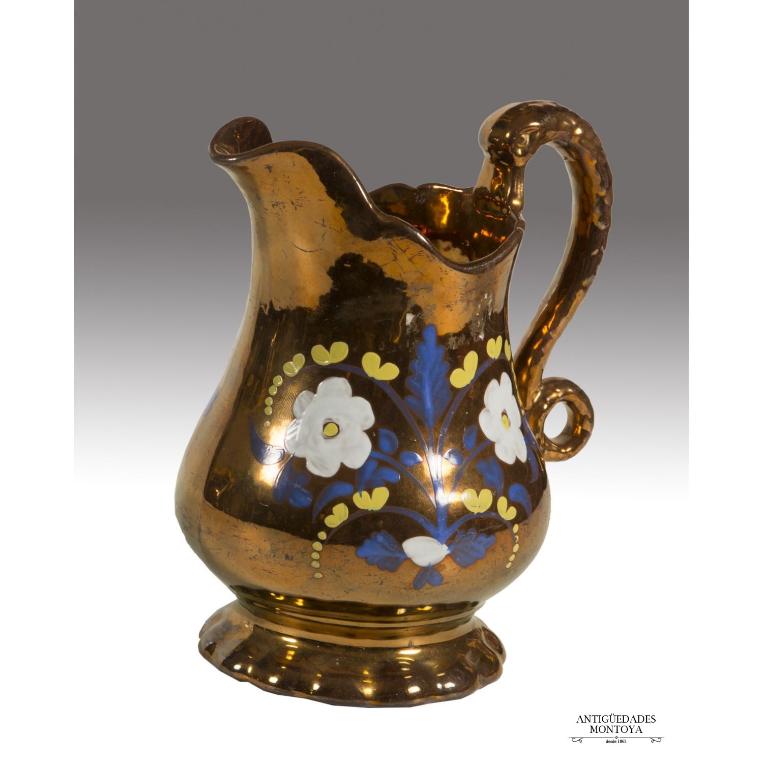Enameled ceramic jug in golden reflection of B ...