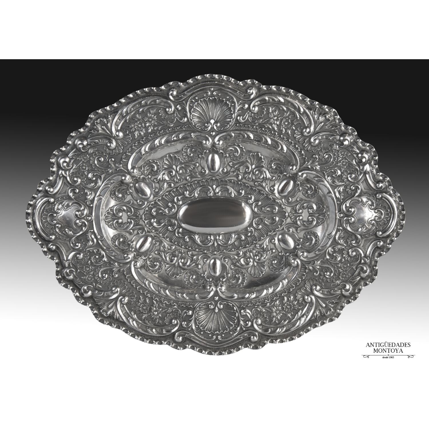 Spanish embossed silver tray.