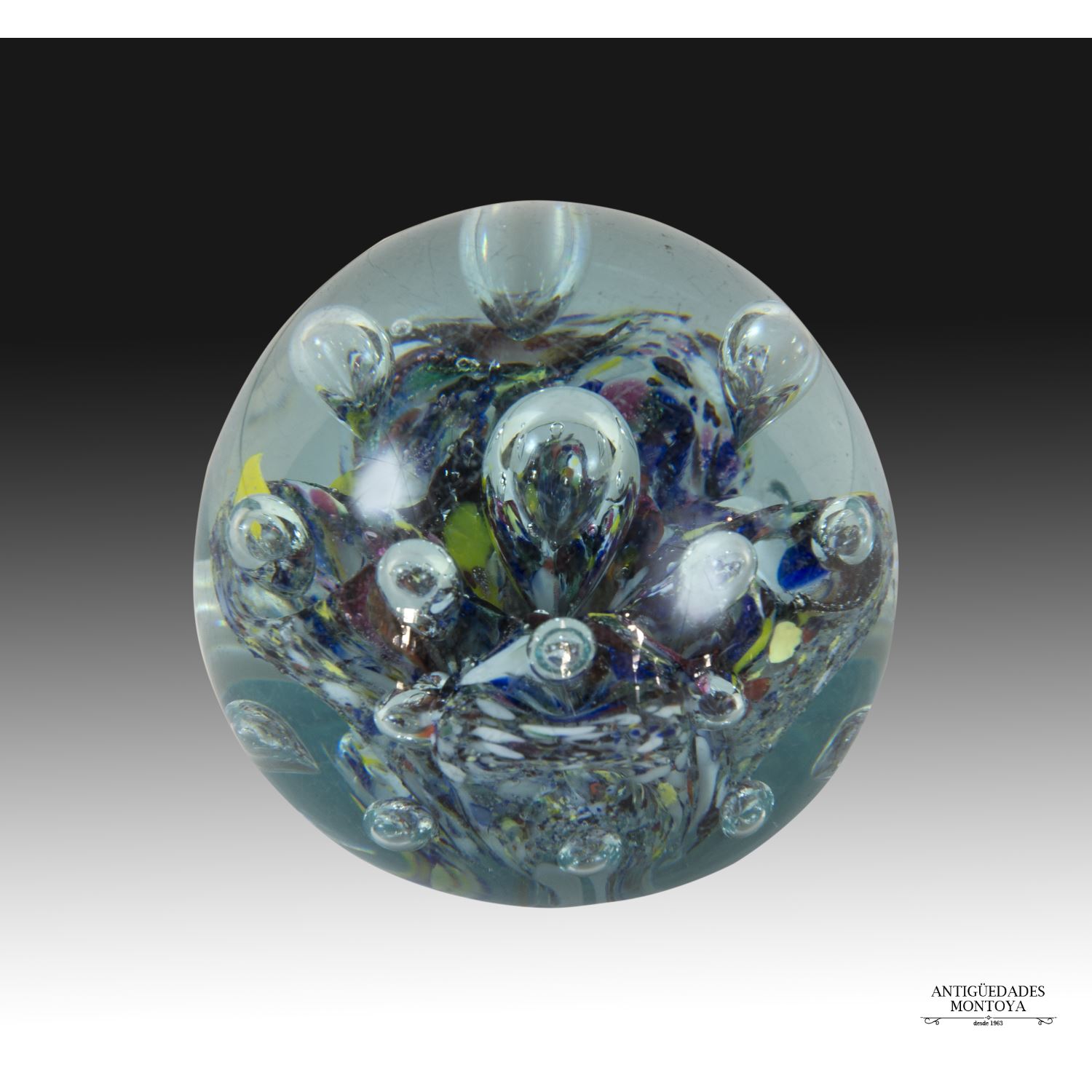 Colored glass paperweight.